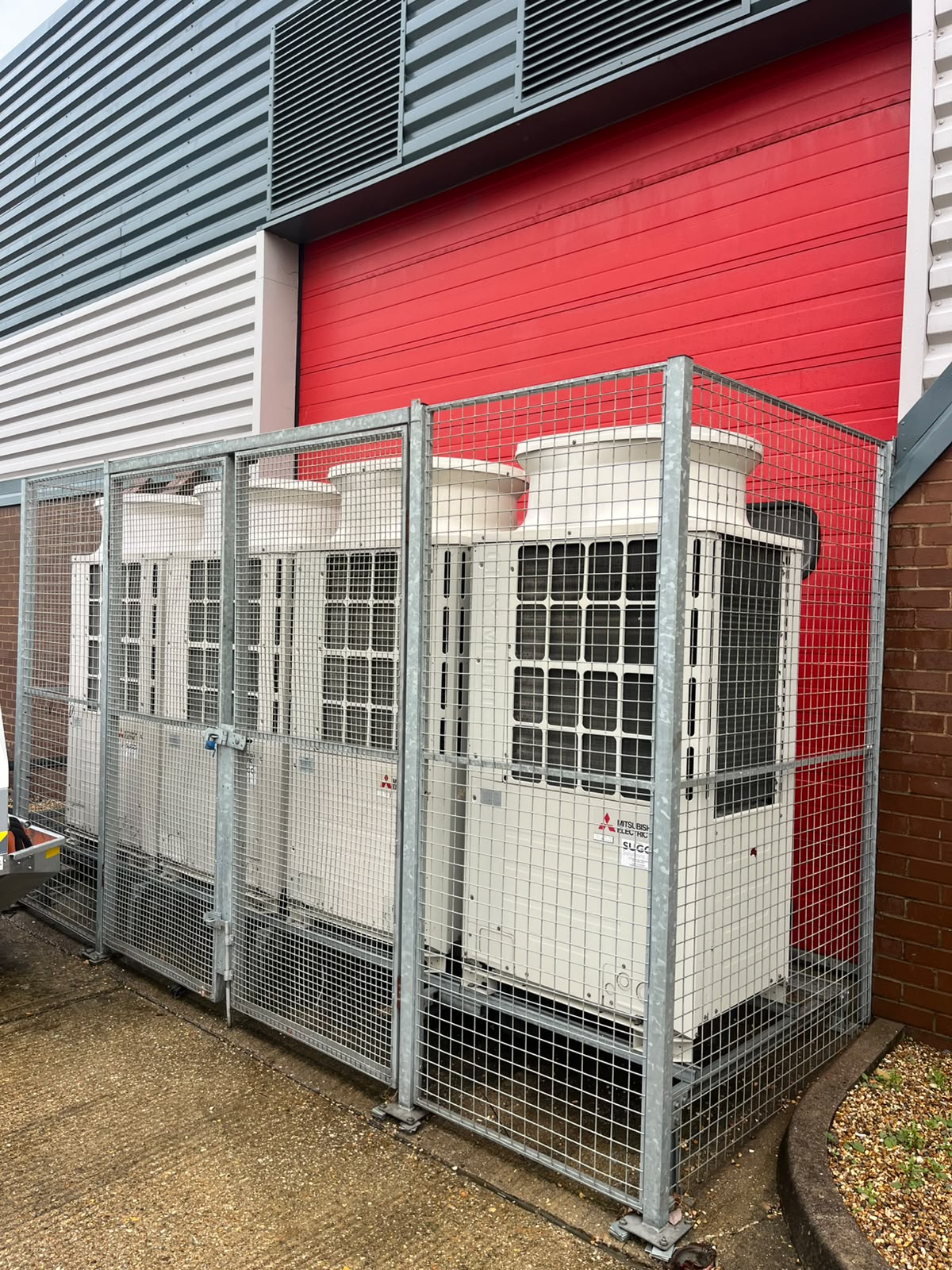 Mitsubishi Electric outdoor air-conditioning units in a protective enclosure